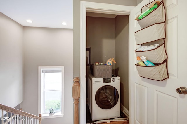 clothes washing area with washer / clothes dryer