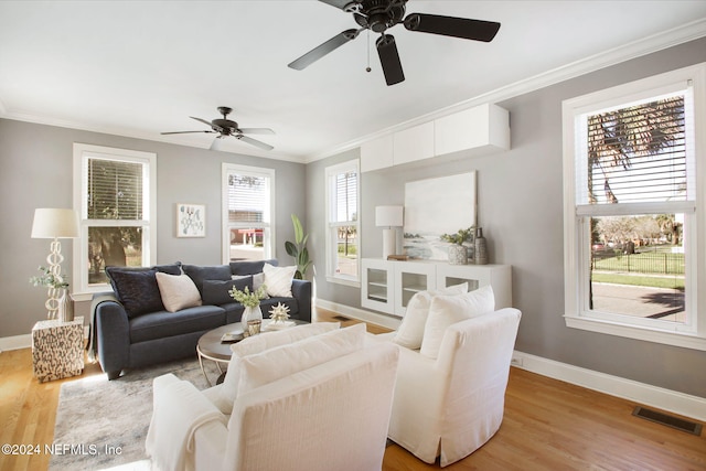 living room featuring ornamental molding and wood-type flooring