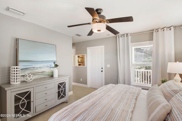 bedroom with ceiling fan and light colored carpet