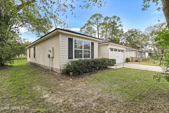 view of property exterior with a lawn and a garage