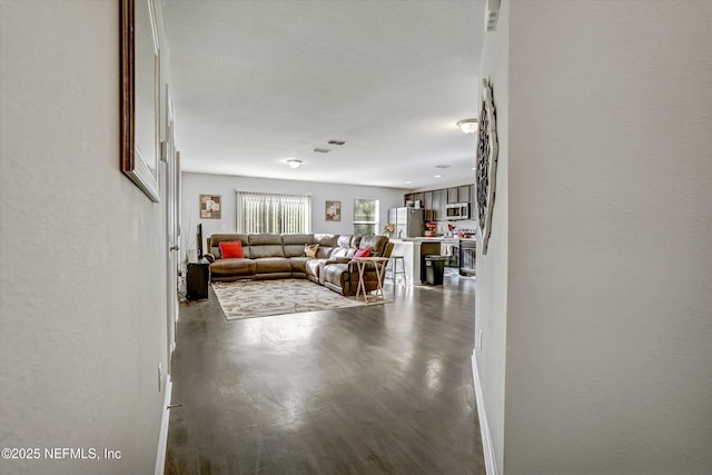 unfurnished living room with dark hardwood / wood-style flooring