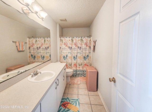 bathroom with a shower with shower curtain, a textured ceiling, vanity, tile patterned flooring, and toilet