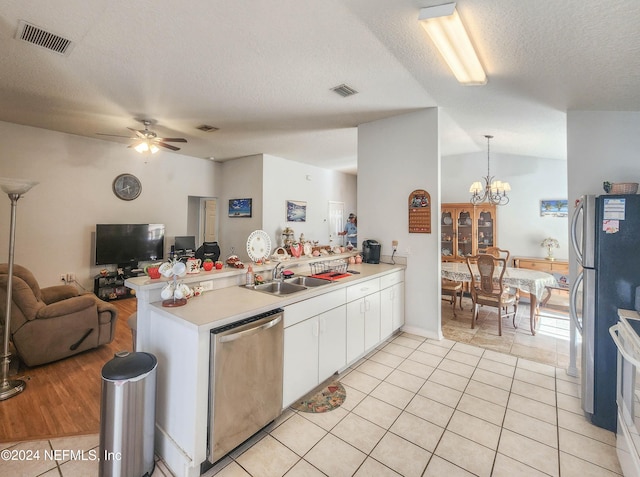 kitchen featuring kitchen peninsula, white cabinetry, light tile patterned flooring, and stainless steel appliances