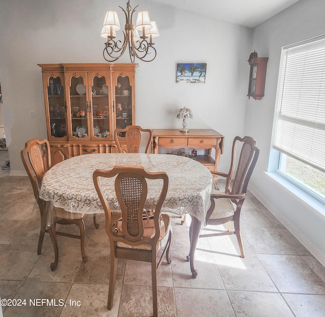 dining room featuring a notable chandelier