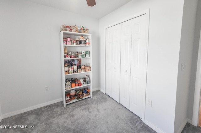 recreation room with light carpet and ceiling fan