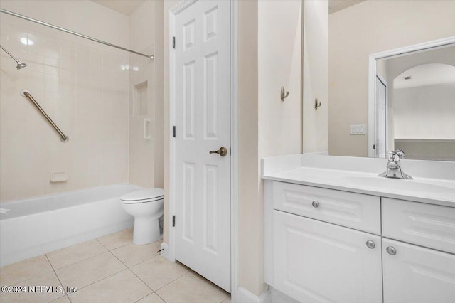 full bathroom with toilet, vanity, tile patterned floors, and tiled shower / bath