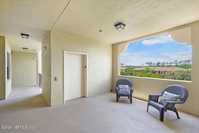 sitting room with elevator and plenty of natural light