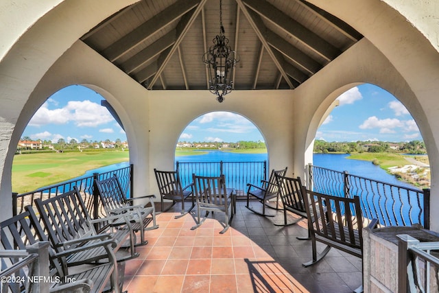 view of patio / terrace featuring a water view and a balcony