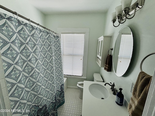 bathroom featuring sink, toilet, and walk in shower