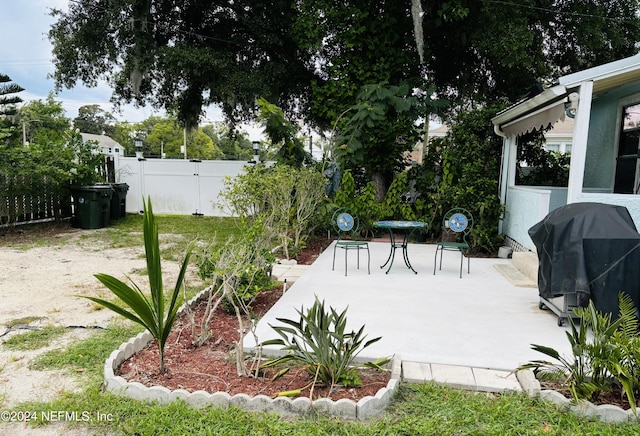 view of patio with a grill