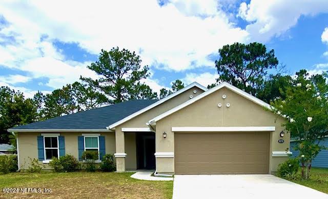 ranch-style home with a garage