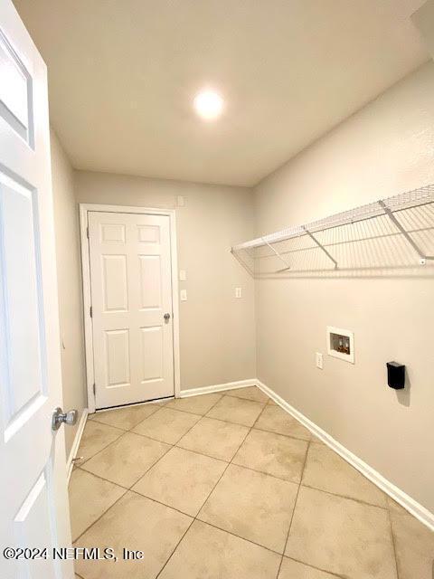 laundry area featuring tile patterned floors and hookup for a washing machine