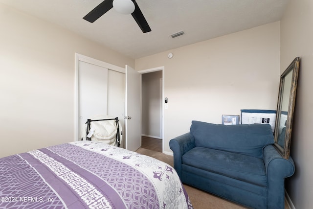 bedroom featuring carpet, a closet, and ceiling fan