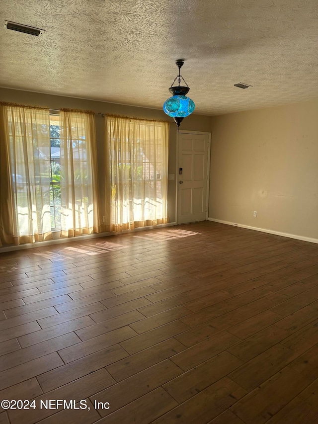 empty room with a textured ceiling