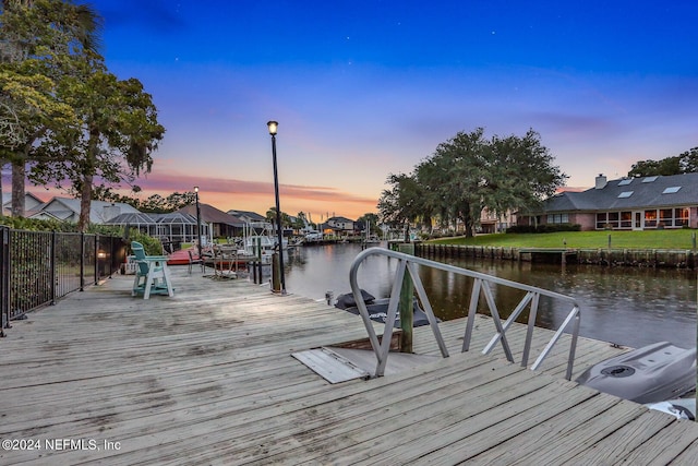 dock area featuring a residential view and a water view