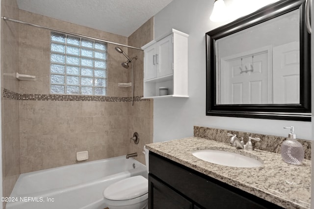 bathroom featuring shower / bath combination, toilet, a textured ceiling, and vanity