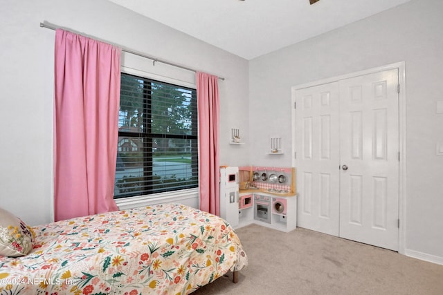 bedroom with ceiling fan, carpet, and baseboards