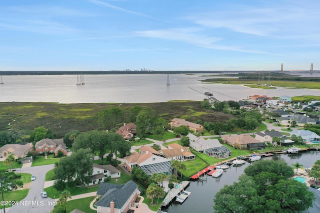 drone / aerial view featuring a residential view and a water view