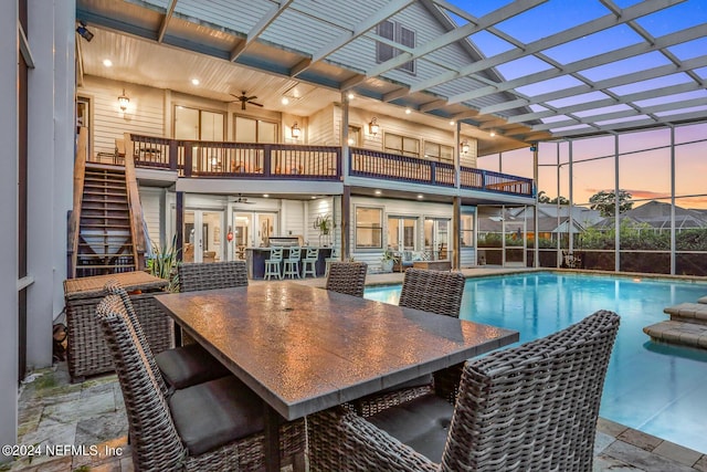 pool at dusk with an outdoor pool