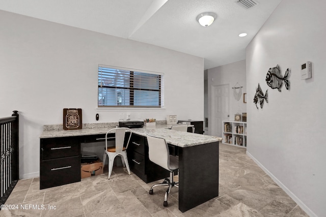 office space with visible vents and baseboards