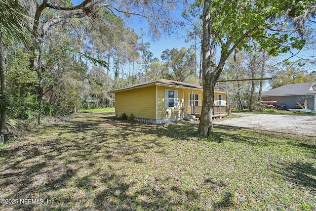 view of home's exterior with a yard