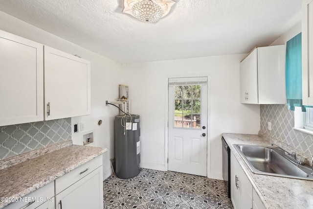 kitchen featuring light countertops, white cabinets, electric water heater, and a sink