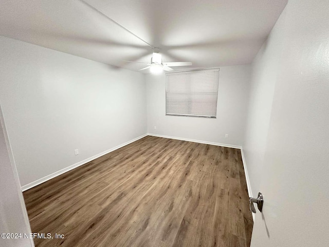 unfurnished room with hardwood / wood-style flooring and ceiling fan