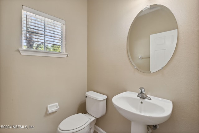 bathroom with toilet and sink