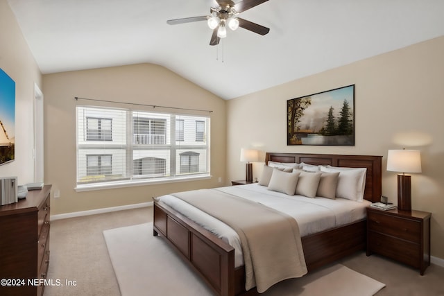 bedroom featuring ceiling fan, light carpet, and lofted ceiling