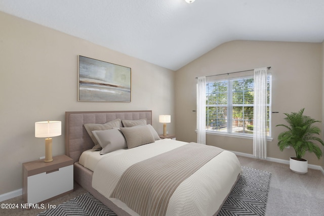 bedroom featuring carpet flooring and lofted ceiling