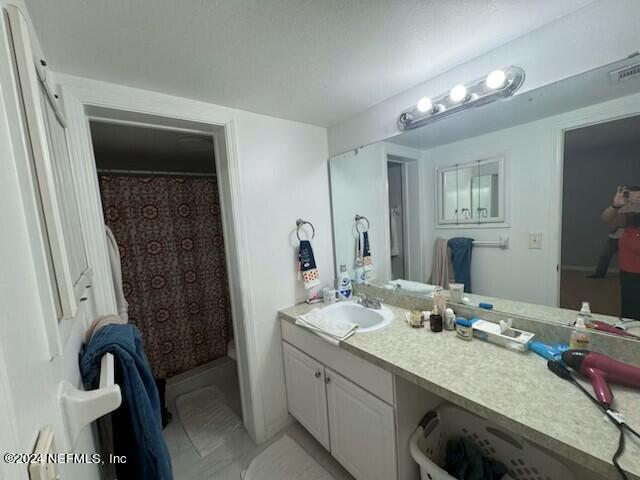 1707 El Prado Rd Unit 2, Jacksonville, FL 32216 - full bathroom with vanity and a shower with shower curtain