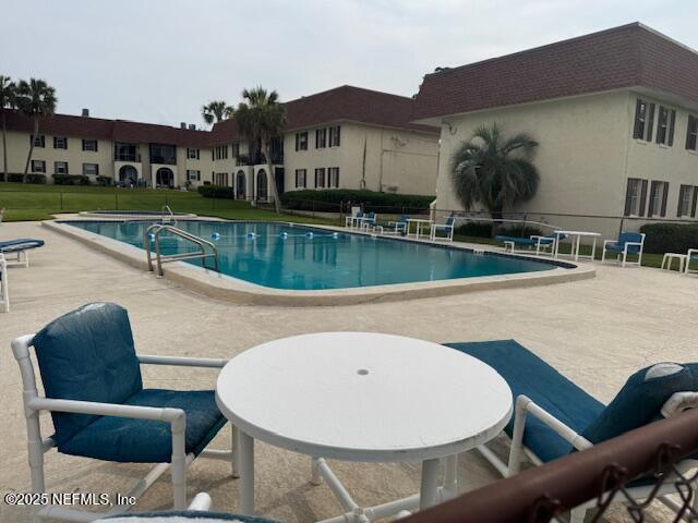 1707 El Prado Rd Unit 2, Jacksonville, FL 32216 - community pool with a patio area