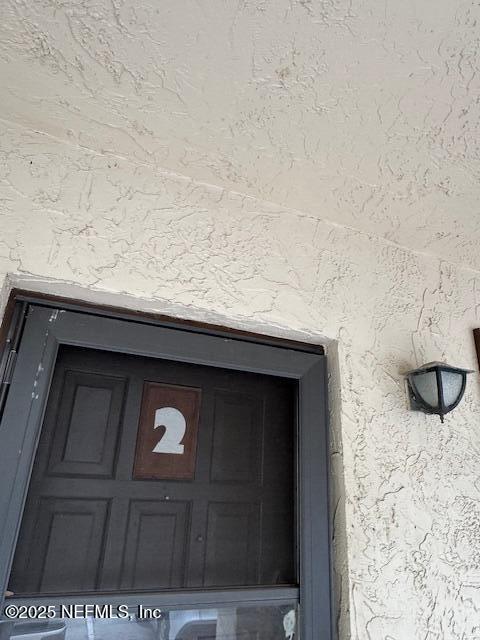 1707 El Prado Rd Unit 2, Jacksonville, FL 32216 - exterior view of stucco siding
