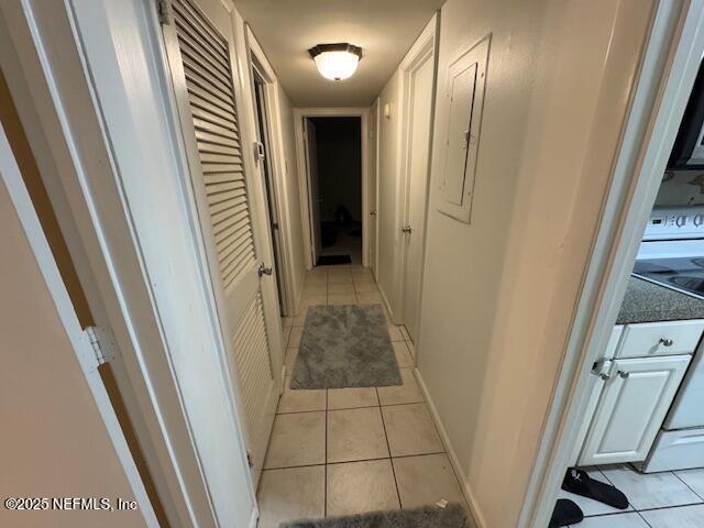 1707 El Prado Rd Unit 2, Jacksonville, FL 32216 - hallway featuring light tile patterned floors and electric panel