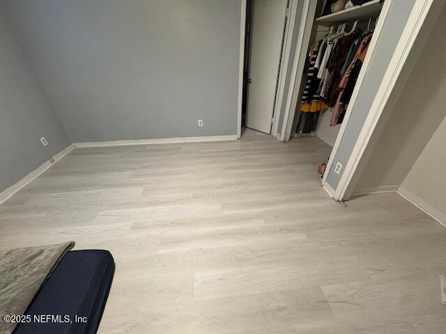 1707 El Prado Rd Unit 2, Jacksonville, FL 32216 - unfurnished bedroom with wood finished floors and a closet