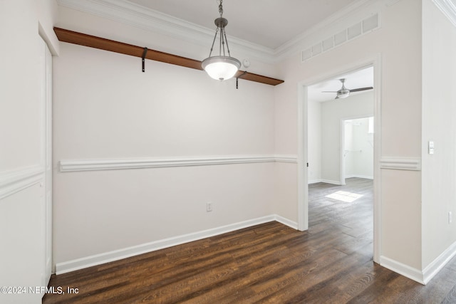 unfurnished dining area with ceiling fan, crown molding, and dark wood-type flooring