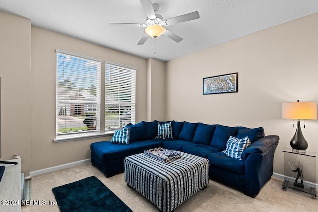 carpeted living room featuring ceiling fan