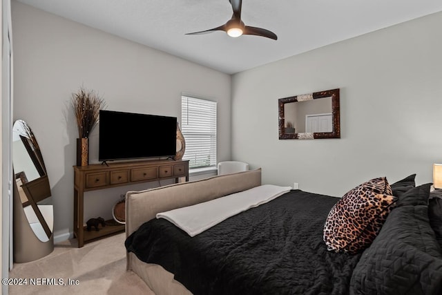 bedroom with ceiling fan and light colored carpet