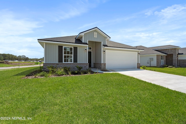 view of front facade featuring a garage and a front lawn