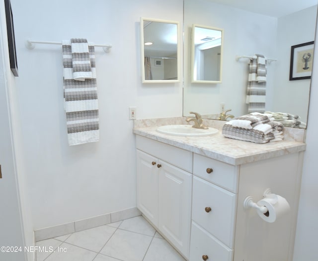 bathroom featuring tile patterned flooring and vanity