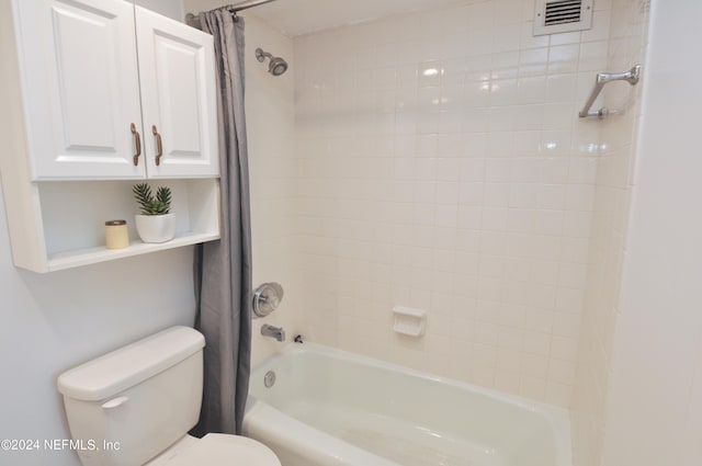 bathroom with toilet and shower / bathtub combination with curtain