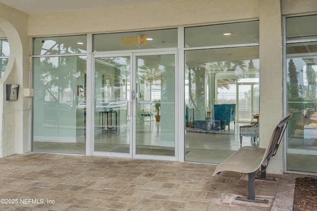 entrance to property with a patio area