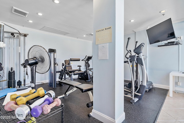 workout area featuring ornamental molding