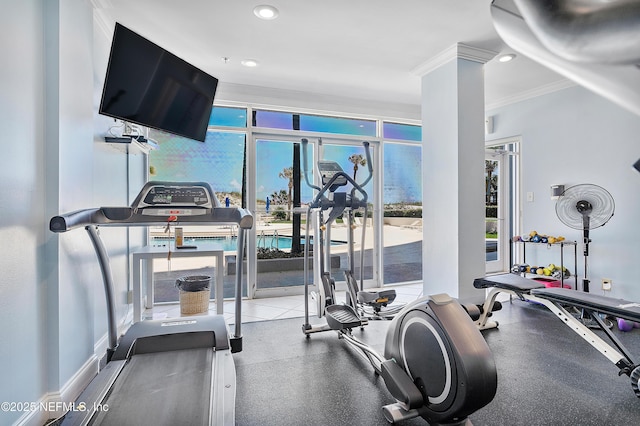 exercise room featuring ornamental molding