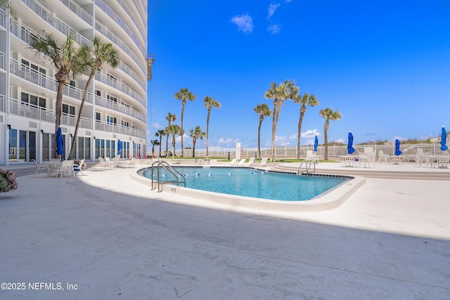 view of swimming pool featuring a patio area