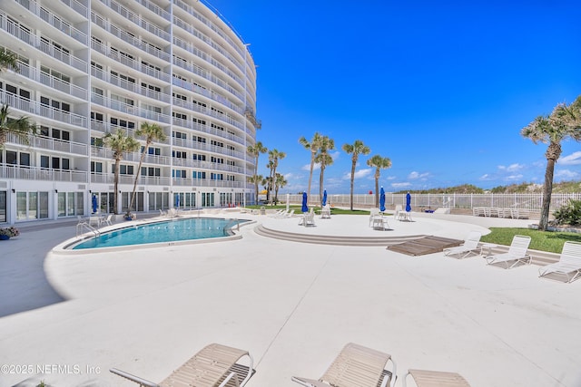 view of swimming pool with a patio area