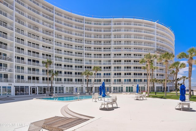 view of property featuring a community pool