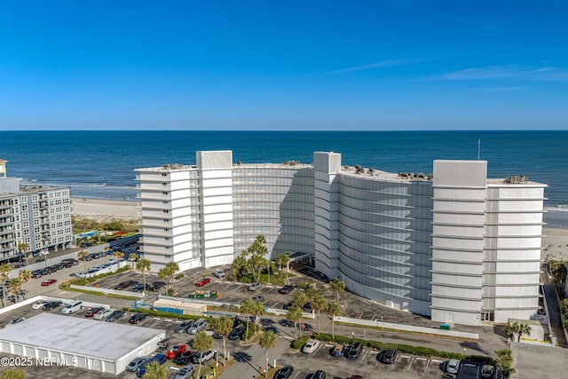 aerial view with a view of the beach and a water view