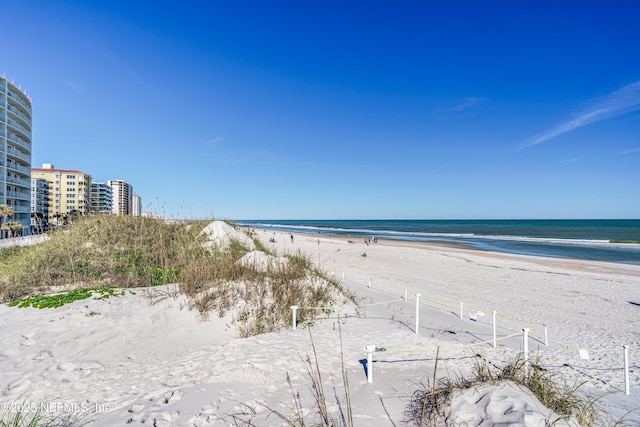 property view of water featuring a beach view