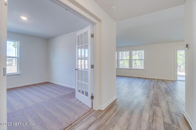 interior space featuring wood finished floors and baseboards